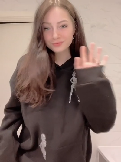Sexy beautiful girl gently shows her breasts